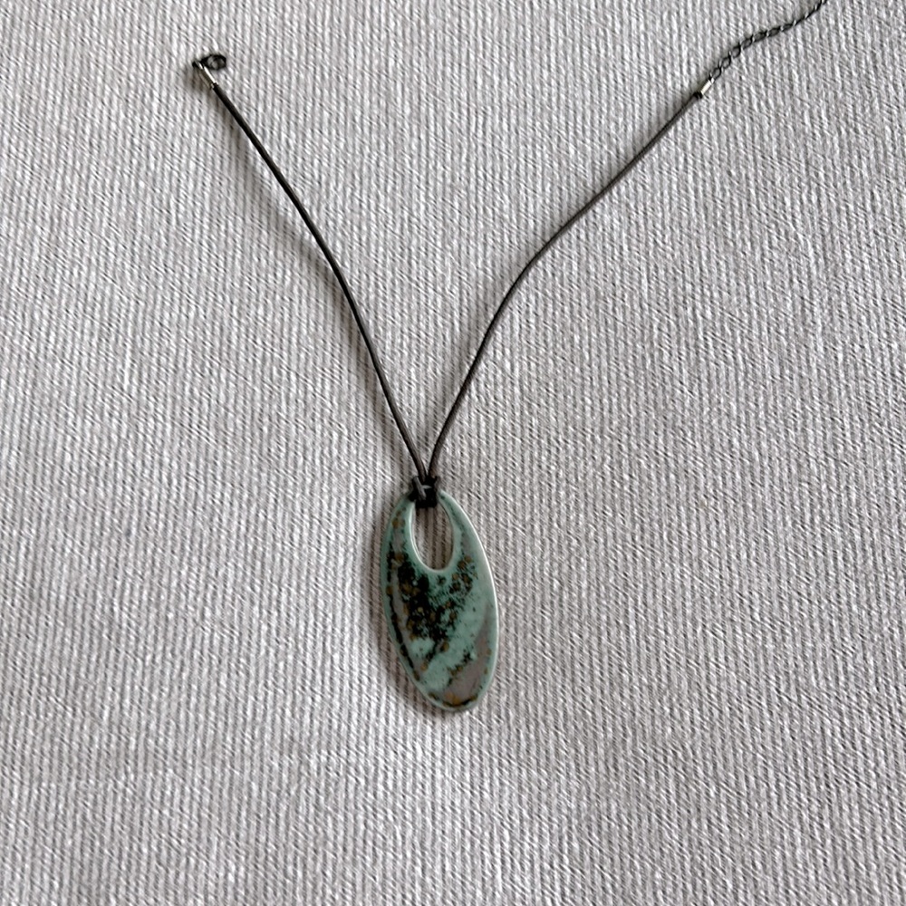 Handmade Ceramic and leather necklace.